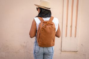 What elements make a women's backpack stylish and attractive